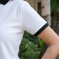 Women White Urban Art Printed Polo T-Shirt with Black Collar